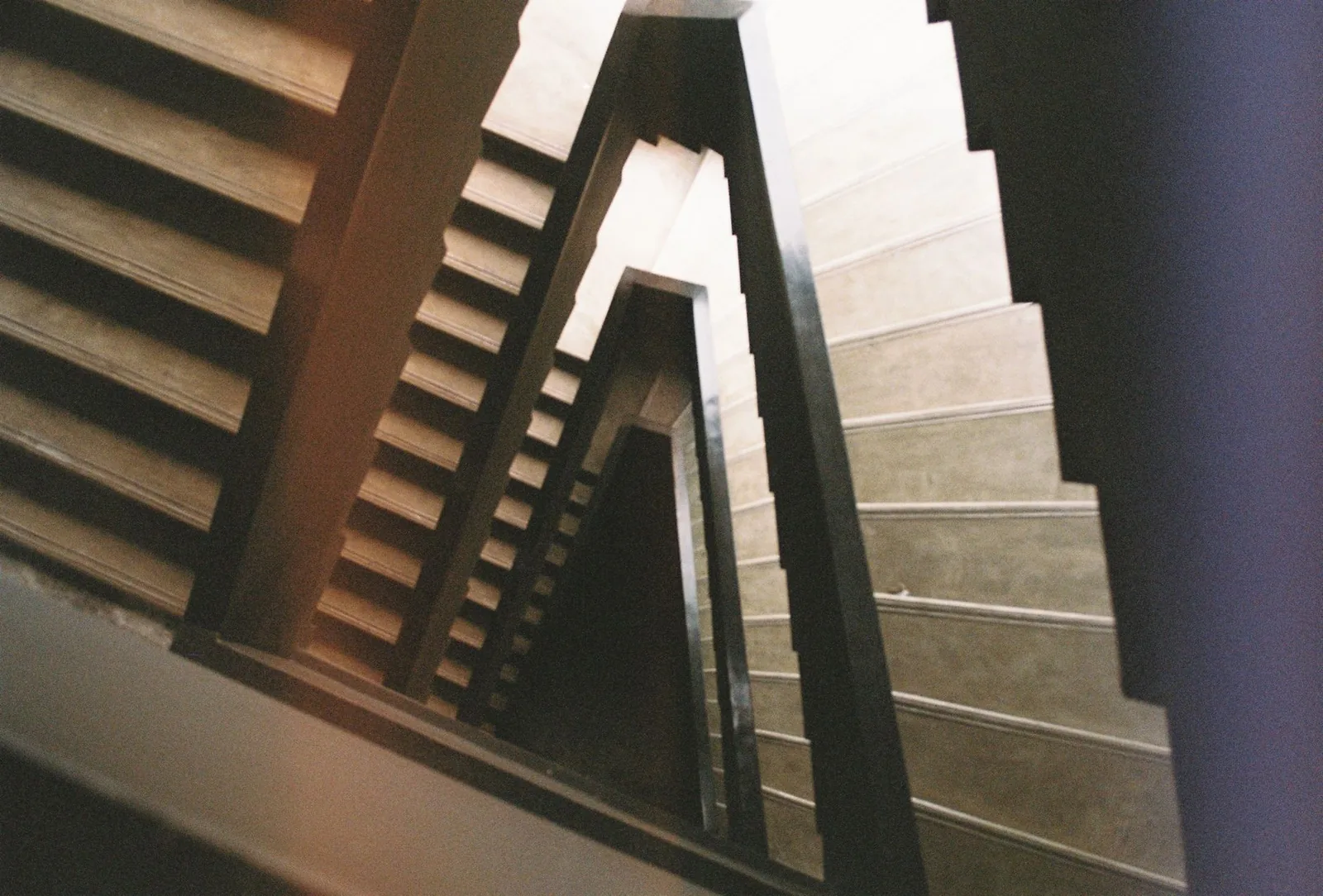 A staircase in a building under construction, suggesting the middle rung of a career